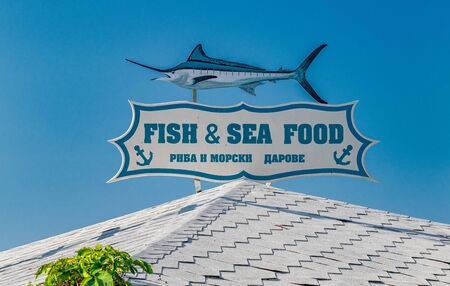 Nessebar, Bulgaria - 7 Sep 2018: A sign of a Fish & Sea Food restaurant in Nesebar ancient city. Nessebar or Nesebr is a UNESCO World Heritage Site.のeditorial素材