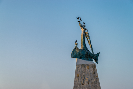 Statue of St. Nicholas at sunrise in Nessebar ancient city, one of the major seaside resorts on the Bulgarian Black Sea Coast.の写真素材
