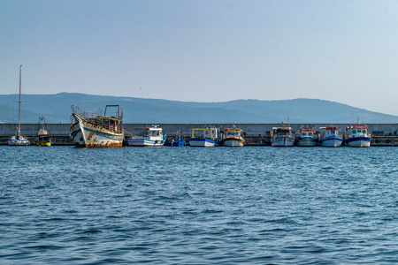 Fishing Boats docked at a harbor port in Nessebar ancient city, one of the major seaside resorts on the Bulgarian Black Sea Coast.の写真素材