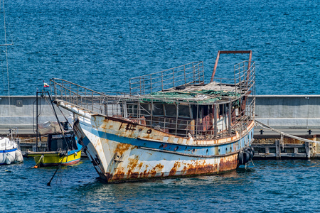 Old rusted Fishing Boat docked at a harbor port in Nessebar ancient city on the Bulgarian Black Sea Coast.の写真素材