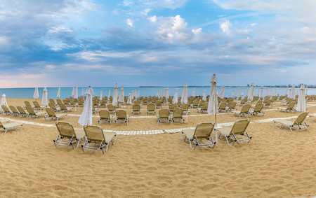 Chairs and umbrellas on a beautiful beach at Sunny Beach on the Black Sea coast of Bulgaria. Panoramic view.の写真素材