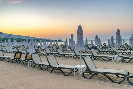 Chairs and umbrellas on a beautiful beach at sunrise in Sunny Beach on the Black Sea coast of Bulgaria.の写真素材