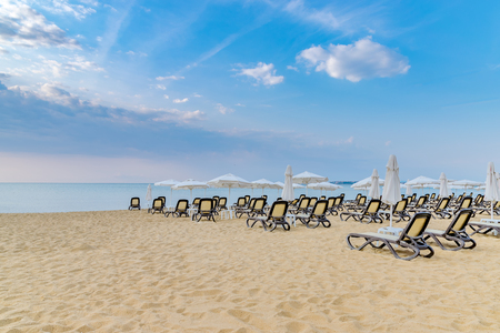 Chairs and umbrellas on a beautiful beach at sunrise in Sunny Beach on the Black Sea coast of Bulgaria.の写真素材