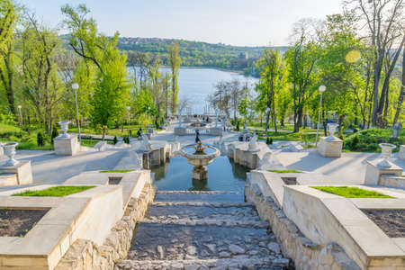 CHISINAU, MOLDOVA - March 25, 2019: View of the Scara Cascadelor landmark in Valea Morilor Park and lake - one of the most popular parks in Chisinau, Republic of Moldova on a sunny day with blue sky.のeditorial素材