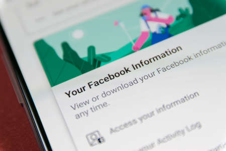 CLUJ, ROMANIA - NOV 06, 2019: Your Facebook information in Facebook settings menu. Facebook data collection illustrative editorial.のeditorial素材