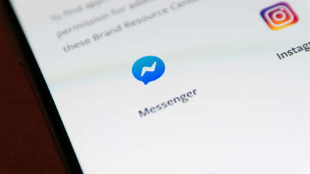 CLUJ, ROMANIA - NOV 06, 2019: Facebook messenger closeup on a smartphone screen settings menu. Facebook messenger illustrative editorial.のeditorial素材