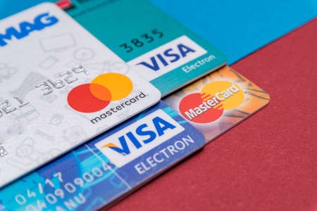 CLUJ, ROMANIA - NOV 08, 2019: MasterCard and VISA macro, closeup on the plastic bank cards. Illustrative editorial, shallow depth of field of the Mastercard Incorporated and Visa Inc.のeditorial素材