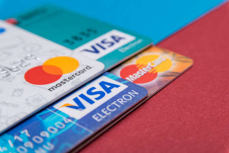 CLUJ, ROMANIA - NOV 08, 2019: MasterCard and VISA macro, closeup on the plastic bank cards. Illustrative editorial, shallow depth of field of the Mastercard Incorporated and Visa Inc.のeditorial素材
