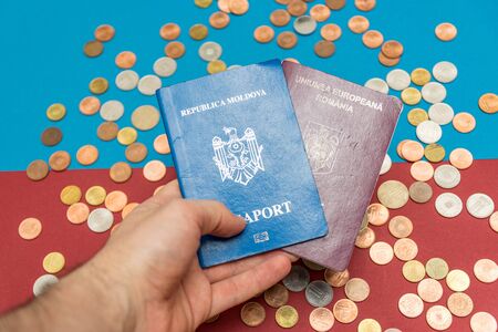 Dual citizenship concept. The Romanian and Moldovan passport. Coloseup of Romanian and Moldovan passport. Multiple citizenships, dual citizenship, multiple nationalities or dual nationality concept.の写真素材