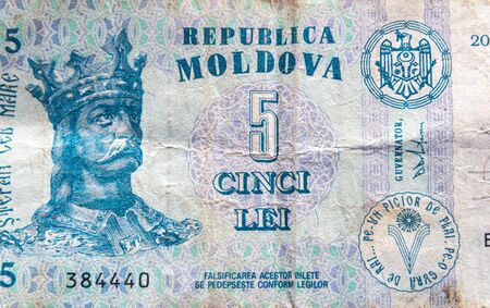 Moldova currency - Stephen the Great portrait close up on the 5 MDL Lei banknote. Coloseup of MDL,...
