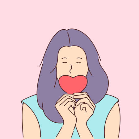 Love story or Valentines day concept. Modern line style illustration. Young smiling girl covers her mouth with a paper red heart.のイラスト素材