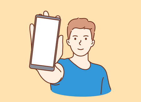 Online communication, smartphone screen. Young smiling man showing smartphone screen with white mockup for text or lettering.のイラスト素材