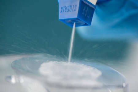Cleaning and disinfection of the plastic product by a medical professional by an antiseptic spray technician.の写真素材