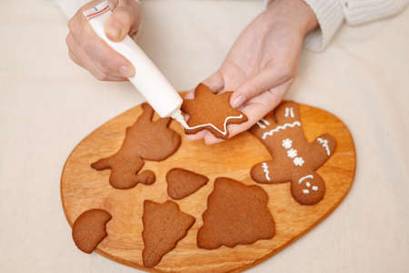 Traditions for celebrating Christmas and New Years making gingerbread sweets. Baking decorations.の写真素材