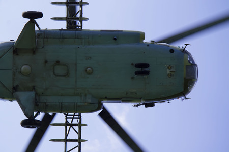 the bottom of the helicopter against the sky