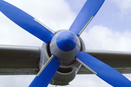 airscrew blue close-up on the wing against the skyの写真素材