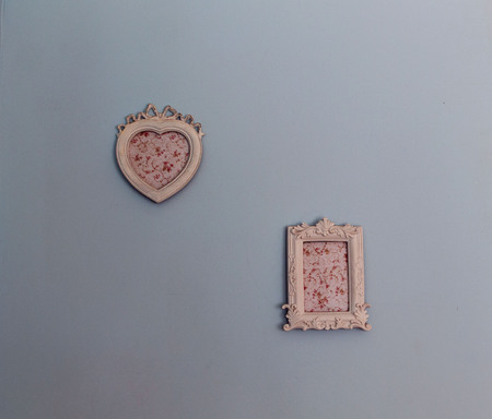two picture frames on the wallの写真素材