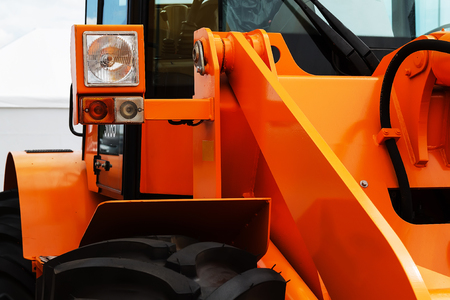 Bulldozer orange part close-up flashlight