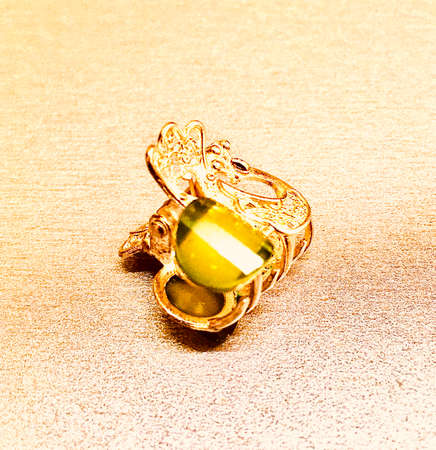 Jewelry in the form of a hair clip, silver with gilding with a stone - amber.