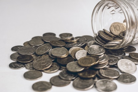 Photo coins for your business on the wood background.の写真素材