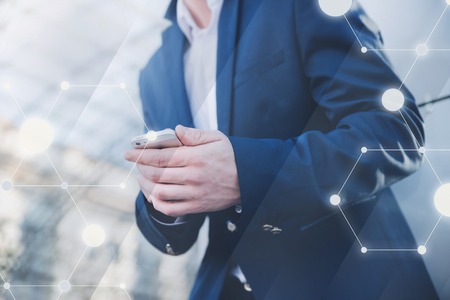 Businessman with telephone in hand. Stylish man in a blue jacket.