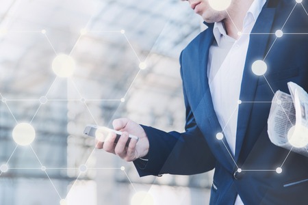 Businessman with telephone in hand. Stylish man in a blue jacket.の写真素材