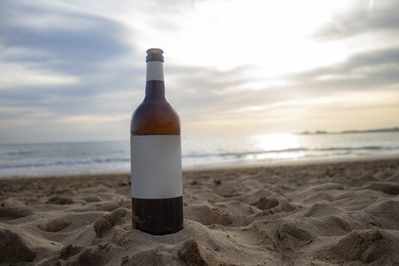 Mock up wine bottle label on the background of the beach and sea on the island of Palma de Mallorca in Spain.の写真素材