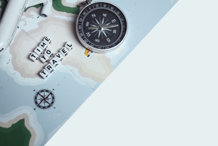 Time to Travel. Idea for tourism with airplane, compass and map on a light background. Concept on...