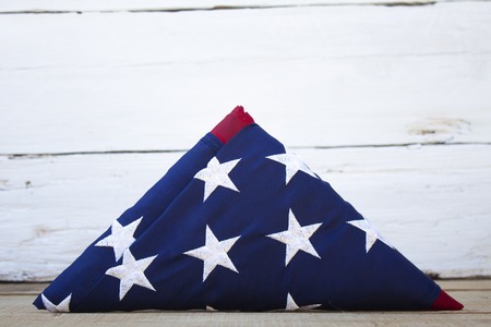 American flag on a wooden background for Memorial Day and other holidays of the United States of...