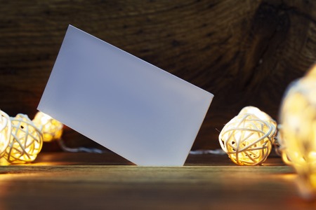 Realistic Mock up of business cards with Garlands, on wooden background.の写真素材