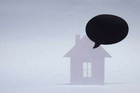 Concept of house from paper with Mock-up black chalk board on white background. Horizontal...