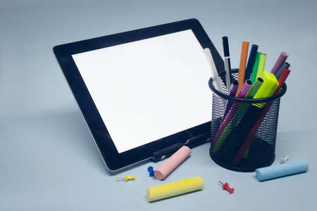 Back to school. Mock up tablet with drawing tools and other stationery on the background