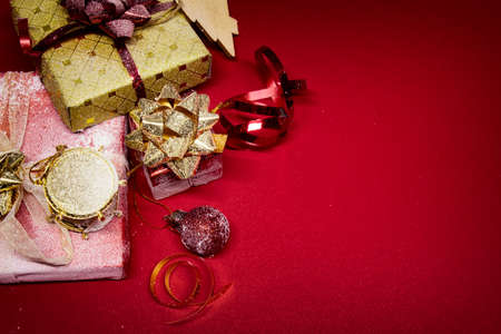 Christmas and New Year composition. Greeting card with gifts, ribbons, toys on the Christmas tree...