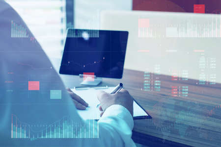 Business analytics (BA) with key performance indicators (KPI) dashboard concept. Tablet with white screen. Businessman works at the computerの写真素材