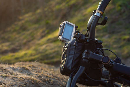 Action Camera on a bike with a bikepacking bag in a waterproof case against the backdrop of natureの写真素材