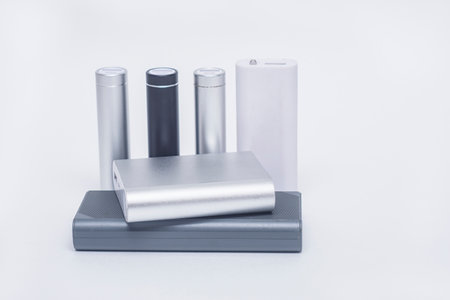 Set of portable chargers for charging gadgets. Power Banks of different sizes on a white backgroundの写真素材