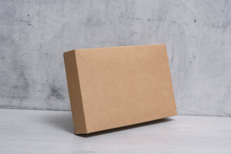 Eco friendly packaging sustainable shipping box on light background. Simple and sturdy packaging for...