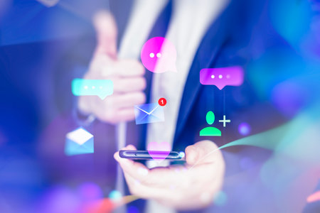 Social media concept. Man holds smartphone with social media icons and digital waves and double exposureの写真素材