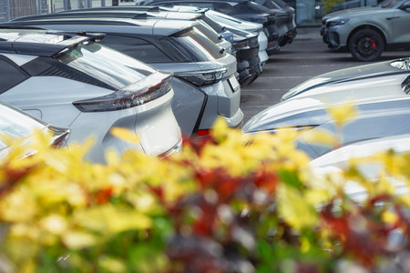 Parked cars on the background of bright colors. Concept of modern electric cars in urban conditionsの写真素材