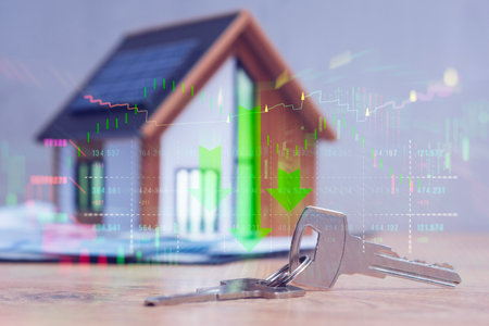 House with solar panels, keys, and overlaid falling stock market graph. Concept real estate market downturn and economic crisisの写真素材