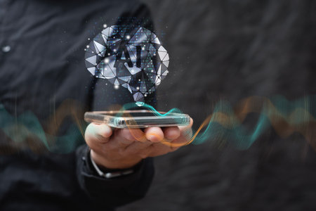 A man wearing a shirt with a geometric brain and AI symbol uses a smartphone with digital waves. Concept artificial intelligence, neural networks and mobile technologyの写真素材