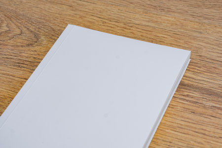 Realistic mockup of book cover, magazine on the wooden background. Concept for demonstrating editorial design, book covers and printed materialsの写真素材