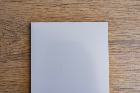 Realistic mockup of book cover, magazine on the wooden background. Concept for demonstrating editorial design, book covers and printed materialsの写真素材