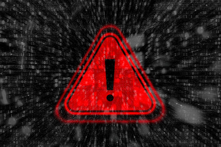 Cybersecurity warning with red warning symbol with binary code. Concept of cyberattacks, data breaches and information security threatsの写真素材
