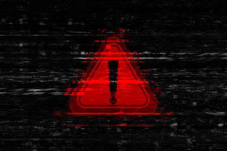 Cybersecurity warning with red warning symbol with digital glitch and binary code. Concept of cyberattacks, data breaches and information security threats.の写真素材