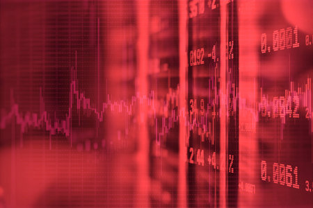 Red financial graph displaying a downturn with abstract statistical data and candlestick patterns....