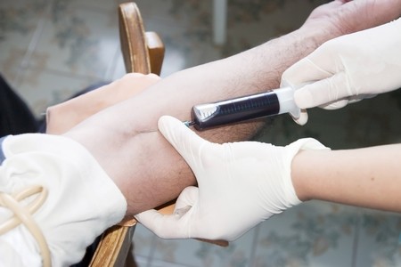 close up of blood extraction in laboratory