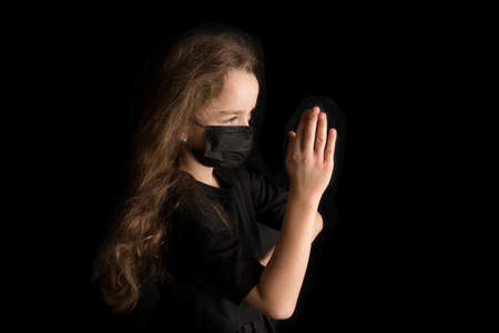 Funny girl wear stylish protective face mask due  pandemic. Family lifestyle on summer school holidays.の写真素材