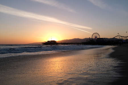 Sunset at Santa Monica Beach, California. The golden color of the sand.の写真素材