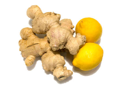 Fresh ginger rhizome with two whole lemons. Isolated on white background.の写真素材